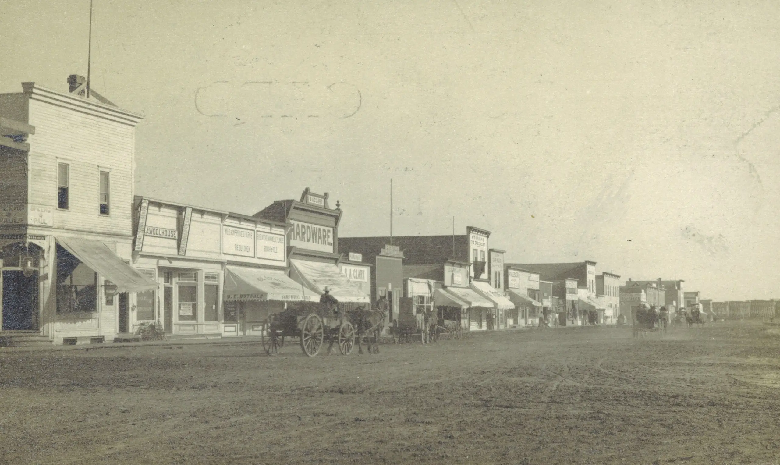 Main Street with horse-drawn wagons